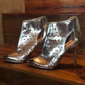 Victoria’s Secret silver stiletto boots.